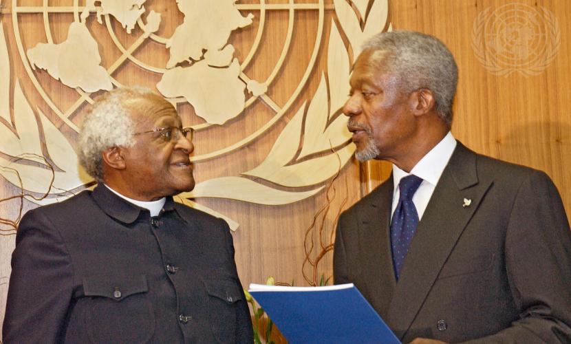 Former Secretary General Kofi Annan speaking with Desmond Tutu, Archbishop of Cape Town, South Africa